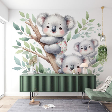 Koala family wallpaper creates a peaceful atmosphere in a soft-toned nursery with natural light