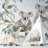 Koala wallpaper mural creating a cozy atmosphere in a modern nursery with natural light