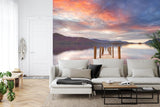 Sunset lake wallpaper transforming master bedroom with warm, natural tones