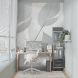 Elegant grey leaf mural wallpaper in home office setting with clean desk setup
