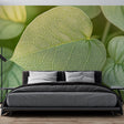 Botanical leaf wallpaper creating a fresh, natural atmosphere in a modern home office with clean white furniture