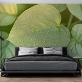 Botanical leaf wallpaper creating a fresh, natural atmosphere in a modern home office with clean white furniture