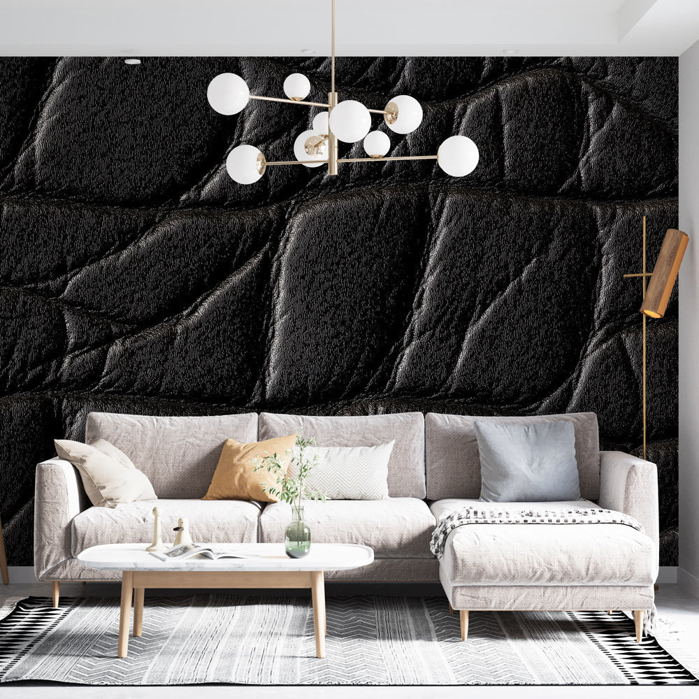 Black leather textured wallpaper creating dramatic effect in modern living room with contemporary furniture