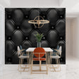 Black leather tufted wallpaper in modern living room with grey sofa and metal accents