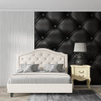 Black tufted leather wallpaper in modern living room creating luxurious atmosphere