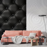Black quilted wallpaper in master bedroom adding sophisticated touch