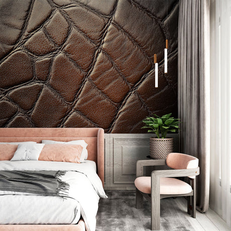Leather texture wallpaper adding luxury to a modern home office with brown leather chair and wooden desk
