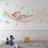 Baby Leopard Wallpaper creating a peaceful nursery atmosphere, shown in a bright modern children's room with natural decor