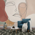 Modern Line Art Face Wallpaper creating a stunning focal point in a minimal Scandinavian living room with earth tone accents