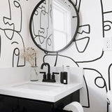 Abstract face wall mural bringing artistic flair to a modern home office setup