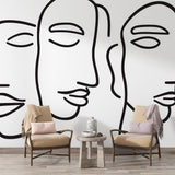 Modern living room featuring Abstract Faces Line Art Wallpaper, showing clean black lines against white walls