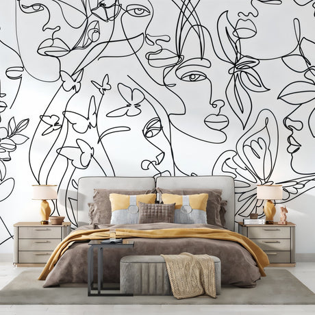 Line art face wallpaper creating an artistic focal point in a modern living room with minimal furniture