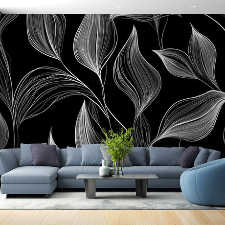 Black and white botanical line art wallpaper showcased in a modern living room with minimal furniture