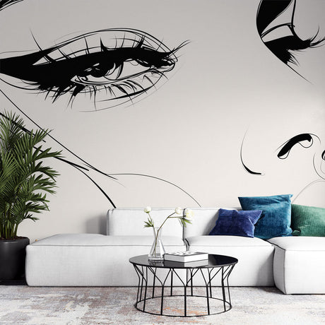 Line art face wallpaper mural creating a dramatic focal point in a modern minimalist living room with white furniture