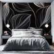 Black and white line art wallpaper with feather pattern creating depth in a modern living room setting