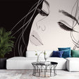 Line art portrait mural wallpaper creating striking contrast in a modern minimalist living room with natural lighting