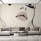 Line art portrait wallpaper creating a bold statement in a modern living room with white furniture and natural light