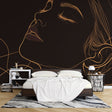 Line art gold profile wallpaper creating a stunning focal point in a modern living room with minimal furniture