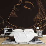 Line art gold profile wallpaper creating a stunning focal point in a modern living room with minimal furniture