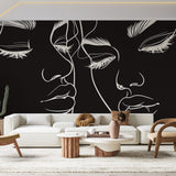 Line art face wallpaper creating modern impact in a minimalist living room with white furniture