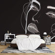 Line art portrait wallpaper creating dramatic impact in a modern living room with minimalist furniture