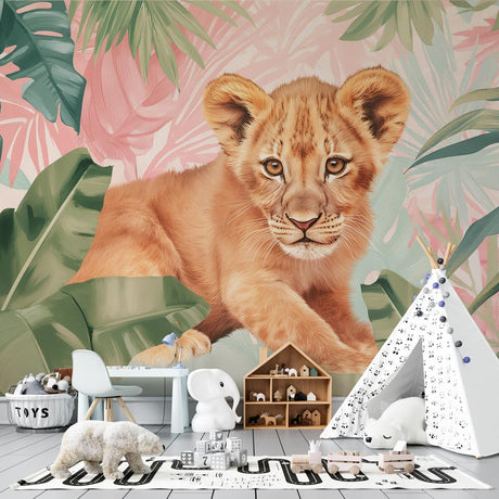 Lion cub safari wallpaper styled in a bright nursery with pink accents and natural decor