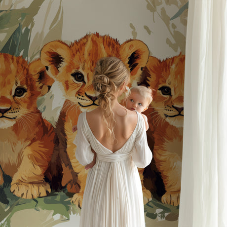 Lion Cubs Wallpaper in bright modern nursery, showing three playful cubs among tropical leaves