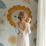 Lion safari wallpaper in bright nursery with white furniture and natural light