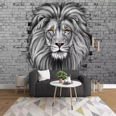Black and white lion mural wallpaper creating drama in modern living room with grey sofa and minimal decor