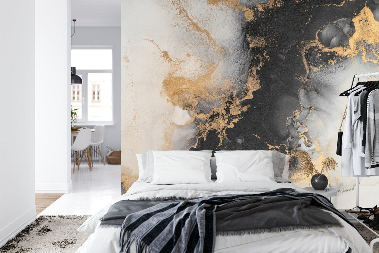 Abstract marble design transforming master bedroom with rich black and gold tones
