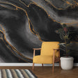 Black and gold marble wallpaper in modern living room with high ceilings and natural light