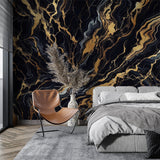Black and gold marble wallpaper creating drama in a modern dining room with pendant lights and wooden furniture