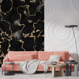 Black and gold marble wallpaper creating luxury feel in modern living room setting