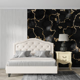 Elegant dining room featuring black and gold marble wall mural