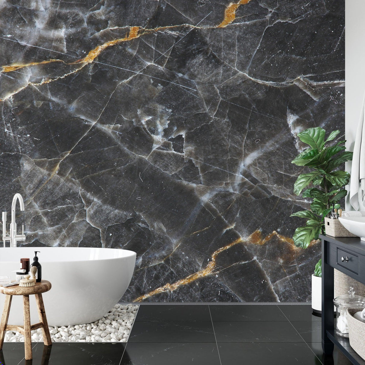 Black and gold marble wallpaper creating drama in a modern dining room with pendant lights