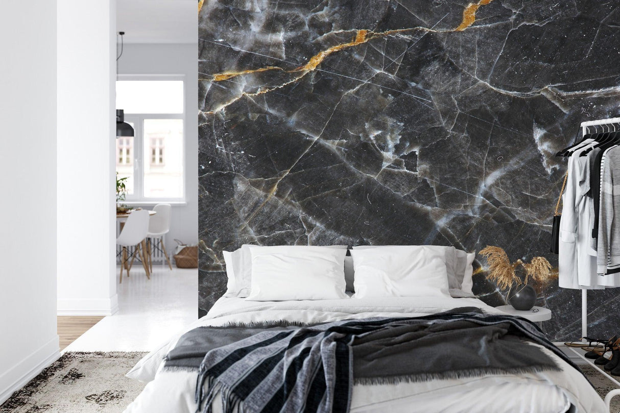 Luxury marble wall mural transforming a master bathroom with gold fixtures