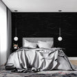 Black marble wallpaper in modern living room showing dramatic veining against dark background
