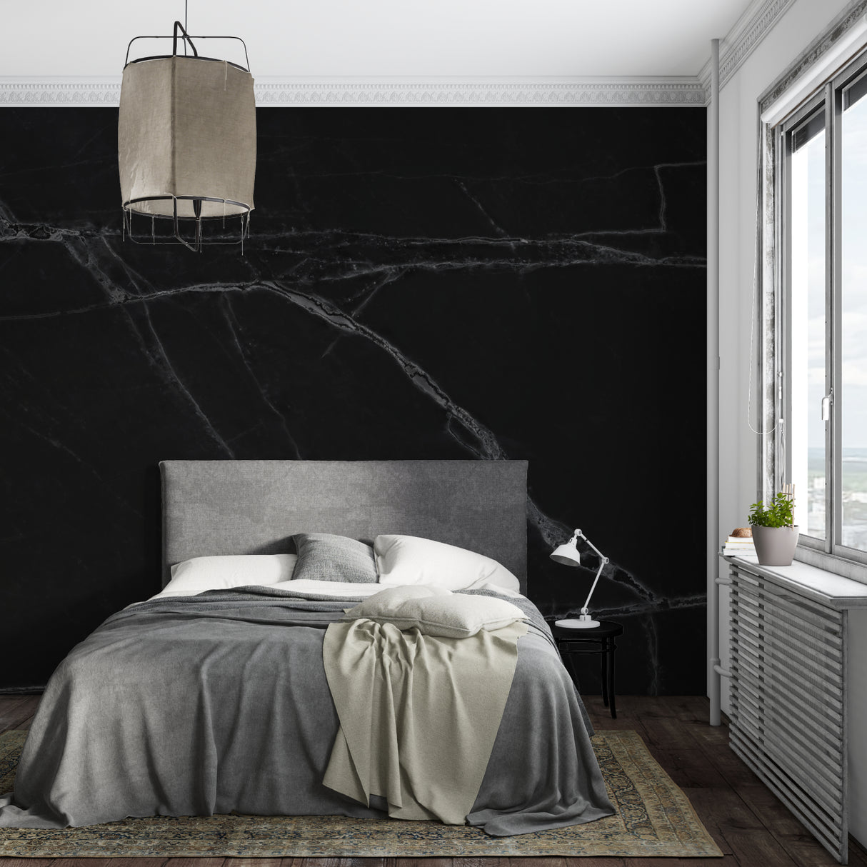 Home office space with dramatic black marble accent wall with white veins