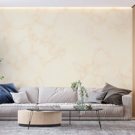 Beige and gold marble wallpaper in modern living room creating an elegant backdrop for grey sofa