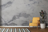 Grey marble effect wallpaper adding luxury to a minimalist bedroom