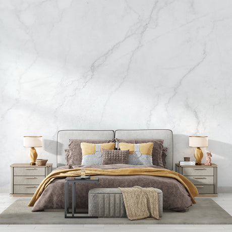 Marble wallpaper creating a luxurious accent wall in a modern living room with grey furniture
