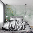 Green and gold marble wallpaper in modern living room creating luxurious atmosphere