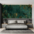 Green marble and gold leaf wallpaper in modern living room with natural light highlighting the metallic details