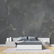 Modern living room with grey and gold marble wallpaper creating an elegant accent wall behind a white sofa