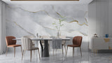 Elegant dining room featuring grey marble wallpaper with gold accents