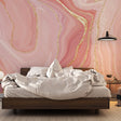 Pink and gold marble wallpaper creating a luxurious atmosphere in a modern living room