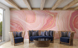 Home office space with pink marble accent wall creating a sophisticated work environment