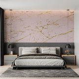 Bathroom interior with pink marble wallpaper showcasing the gold details in artificial lighting