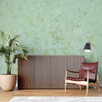 Sage green marble wallpaper in modern living room showing natural stone texture and soft lighting