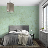 Bathroom decorated with sage green marble effect wallpaper in natural light